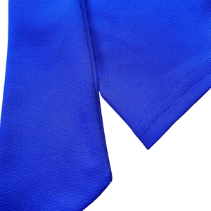 Close-up of royal blue knitted fabric showing high-density texture and double-needle stitching