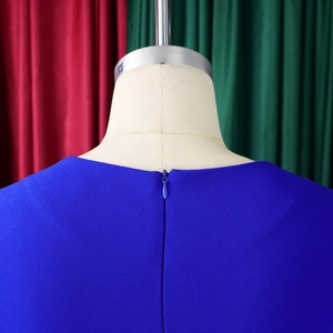 Detail of the high-waisted royal blue dress showing the invisible back zipper closure