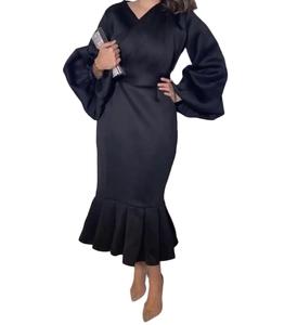 Detail of elegant black long lantern sleeve V-neck dress with ruffled mermaid hemline