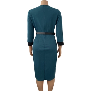 Detail of teal long sleeve dress showing back invisible zipper and black contrast cuffs