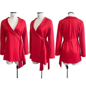 Detailed views of red wrap-around long sleeve tunic with waist tie on white mannequins