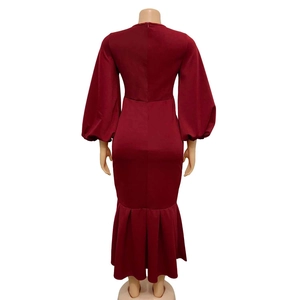 Detail view of the elegant mermaid dress back featuring a hidden zipper and long lantern sleeves