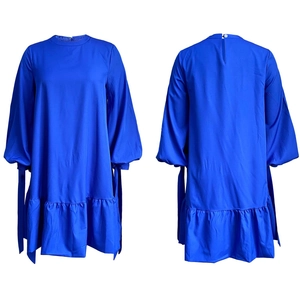 Royal blue lantern sleeve dress with tie cuffs and ruffled hem detail from front and back