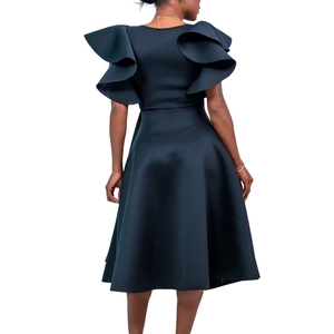 Detail view of layered ruffle sleeves and cinched waist on elegant black dress back