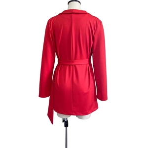 Back view of red long-sleeve office blazer dress with waist belt detail and center seam