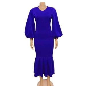 Detail view of bright blue mermaid dress featuring elegant lantern sleeves and slim fit