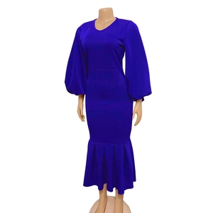 Detail view of royal blue V-neck long sleeve dress with puff sleeves and mermaid hemline