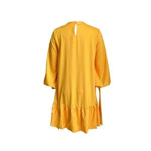 Detail view of the round neckline and back button closure on this bright yellow dress