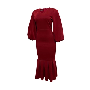 Detailed view of wine red dress featuring puffy lantern sleeves and a ruffled mermaid hem