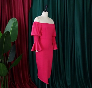 Detail of off-shoulder rose red dress with layered ruffle bell sleeves and asymmetrical hem