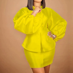 Vibrant yellow two-piece set featuring puff sleeve waist top and fitted bodycon skirt