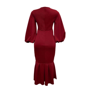 Detailed back view of a burgundy V-neck dress featuring a hidden zipper and mermaid hem
