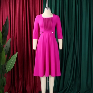 Detailed view of rose red square neck dress with vertical pleats and pearl waist buttons