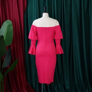 Detail view of the fuchsia bodycon midi dress with bell sleeves and back zipper closure