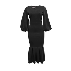 Close-up detail of V-neckline and elegant puff sleeves on this black mermaid dress