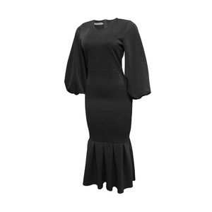 Detail of black V-neck dress featuring lantern sleeves and a fishtail pleated hemline