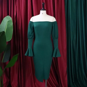 Detail of elegant off-shoulder dark green bodycon dress with flared sleeve design