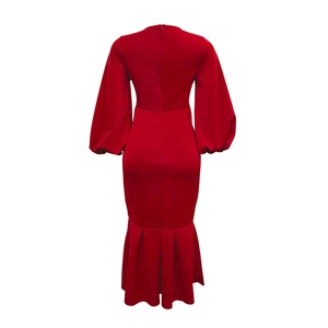Rear view detail of a red V-neck mermaid dress showing the invisible zipper and puff sleeves