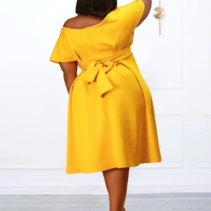 Women's plus size yellow V-neck short sleeve dress with large back bow detail