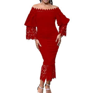 Close-up of red lace patchwork detail and lantern sleeves on the off-shoulder dress