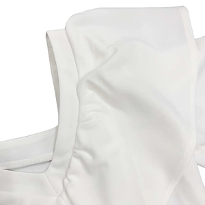 Macro shot of elegant white ruffle layers and fine pleated fabric texture details