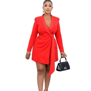 Detail of red slim-fit wrap blazer dress with waist tie and deep V-neckline
