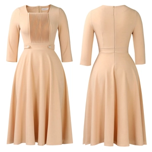 Detail view of square neck pleated dress in beige with decorative double waist buttons
