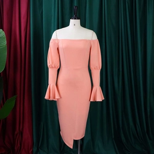 Detailed view of elegant off-the-shoulder coral dress featuring flared sleeves and hem slit