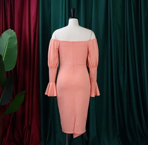 Detail of coral orange off-shoulder bodycon dress featuring elegant bell sleeves