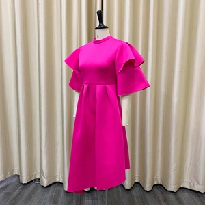 Detail view of the rose red evening dress with double layer ruffle sleeves and mock neck