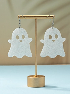Detail of white glitter ghost earrings on gold stand for Halloween parties