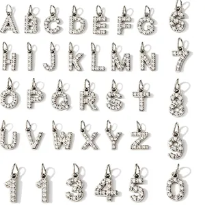 Micro-pave cubic zirconia alphabet and number pendants set in polished titanium steel