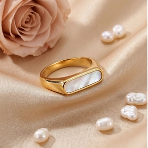 Polished gold stainless steel ring with rectangular white shell on champagne silk