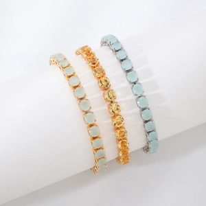 Three elegant round-cut cubic zirconia tennis bracelets in gold and silver finishes