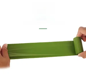 Macro shot of a green biodegradable dog poop bag showing thickness and durability