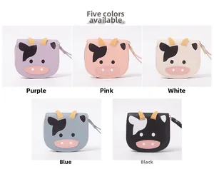 Detailed view of cartoon cow wallets in five colors with wrist straps and zippers
