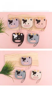 Detailed view of colorful cartoon cow pattern wallets with zip closure and wrist straps