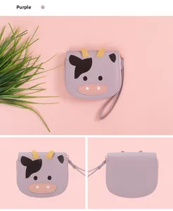 Detail of purple cartoon cow small wallet showing PU leather and golden zipper