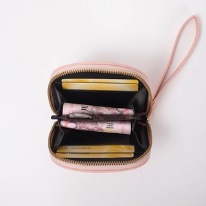 Pink minimalist short zipper wallet for women with wristlet strap and accordion card slots
