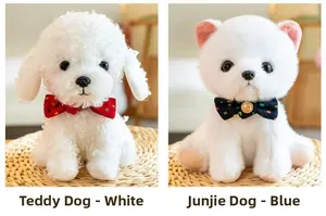 Detail of white plush Teddy with red bow and Shunsuke dog with blue bell bow