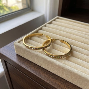 Detail of 40mm 18k gold plated hoop earrings with colorful inlaid rhinestones