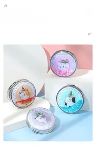 Detail of four mini folding mirrors with quicksand glitter and cartoon unicorn cat designs