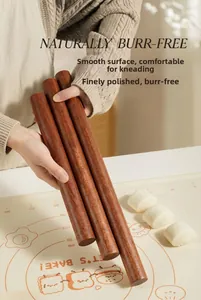 Detail of natural ebony wood rolling pins featuring smooth polished burr-free surfaces