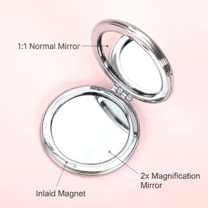 Silver folding compact mirror with 1:1 and 1:2 magnification and magnetic closure