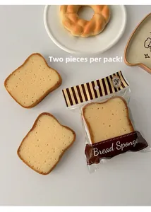 Detail shot of bread-shaped sponges in clear packaging with realistic porous texture