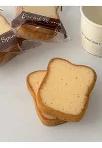 Detailed view of toast-shaped dishwashing sponges with porous texture and bread-like design