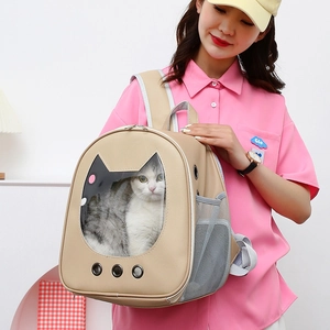 Detail view of cat-shaped window and metal air vents on beige leather pet backpack