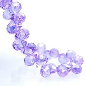 Macro detail of faceted purple K9 crystal glass beads with light-reflecting rhombus surfaces