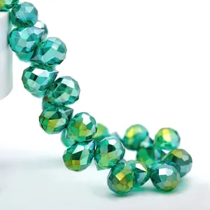Macro shot of 8mm green teardrop faceted K9 crystal glass beads with high light refraction