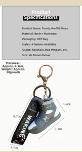 Detailed view of trendy graffiti sneaker keychain with resin material and fabric wrist strap